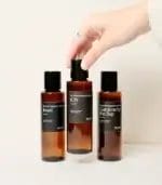 Hand Holding Up MScents ION Essential Purifier Oil