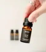 Hand Holding MScents ION Pure Essential Oil