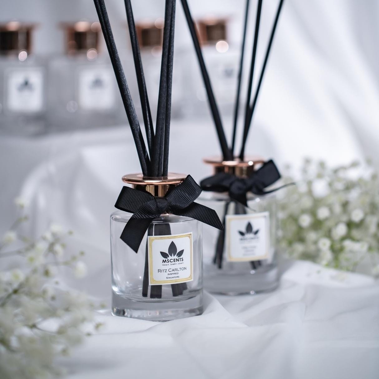 Reed diffusers with black ribbon for a hotel room